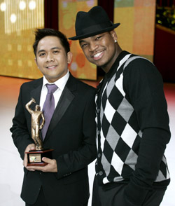 Candido Revilles, third place winner, with “Voice of McDonald’s® II” judge and multi-platinum and Grammy Award-winning artist and songwriter Ne-Yo